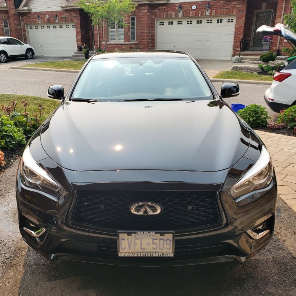 The exterior paint of a car that is shiny after getting a mobile car detailing service.