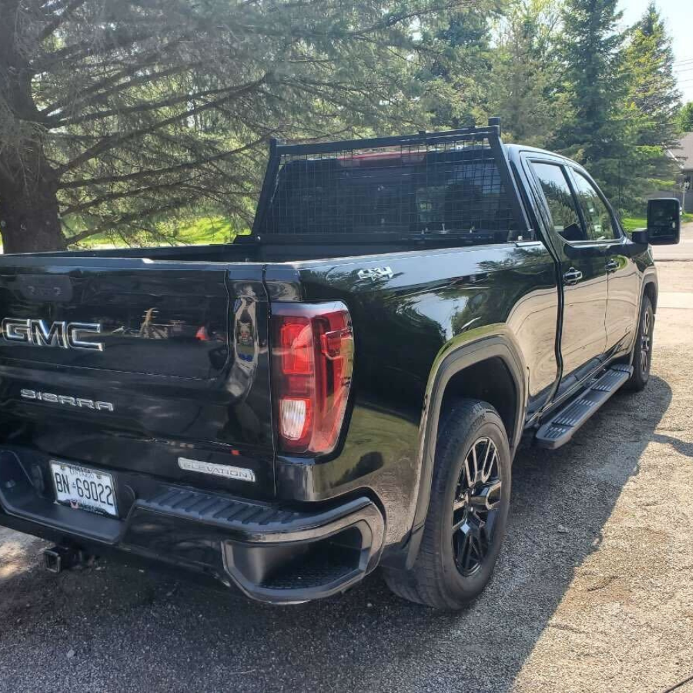 The exterior of a GMC pickup truck that was just detailed.